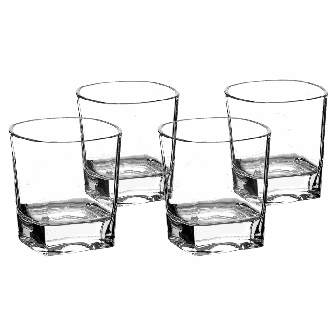 Four empty glass tumblers on black background.